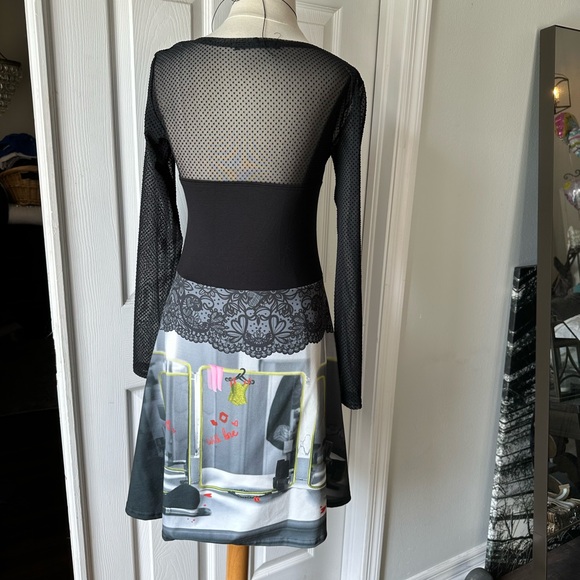 fun unique dress ! slight flare skirt and a sheer back and sleeves. - Picture 3 of 6